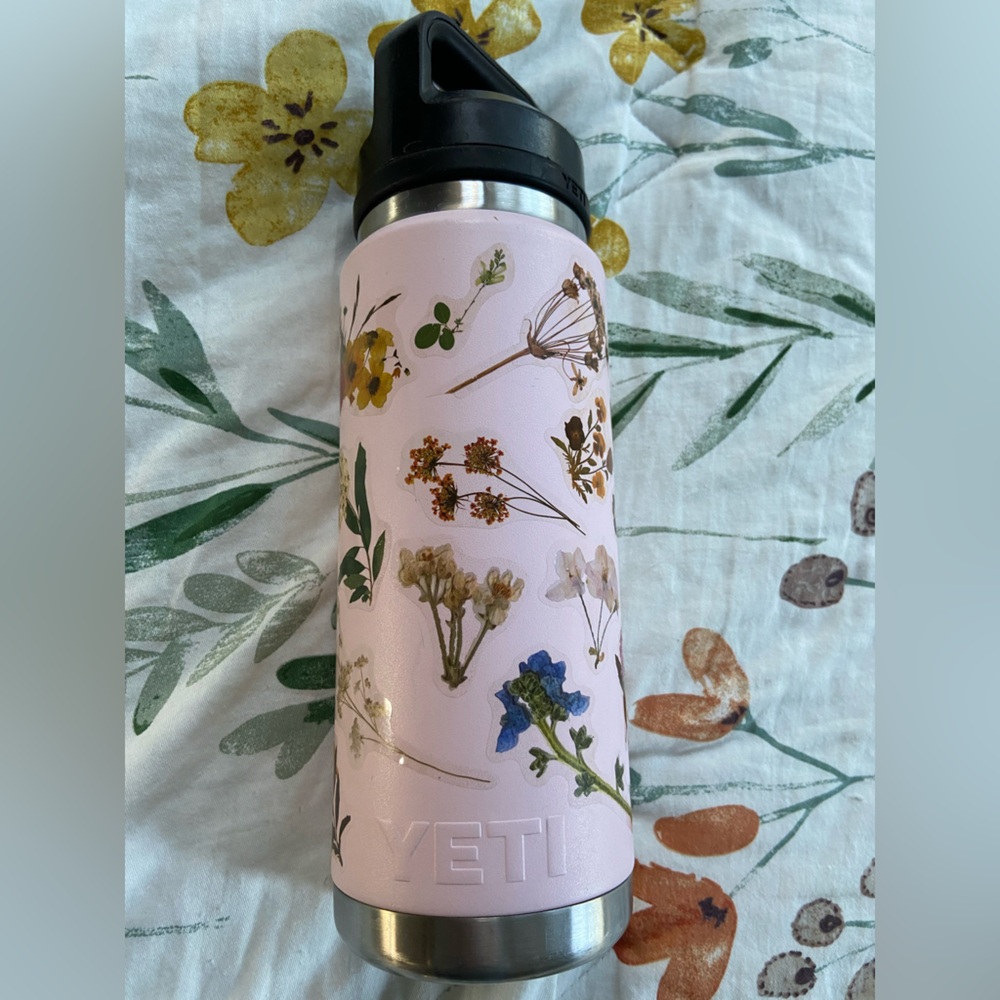 Yeti water bottle. Pink with flower stickers